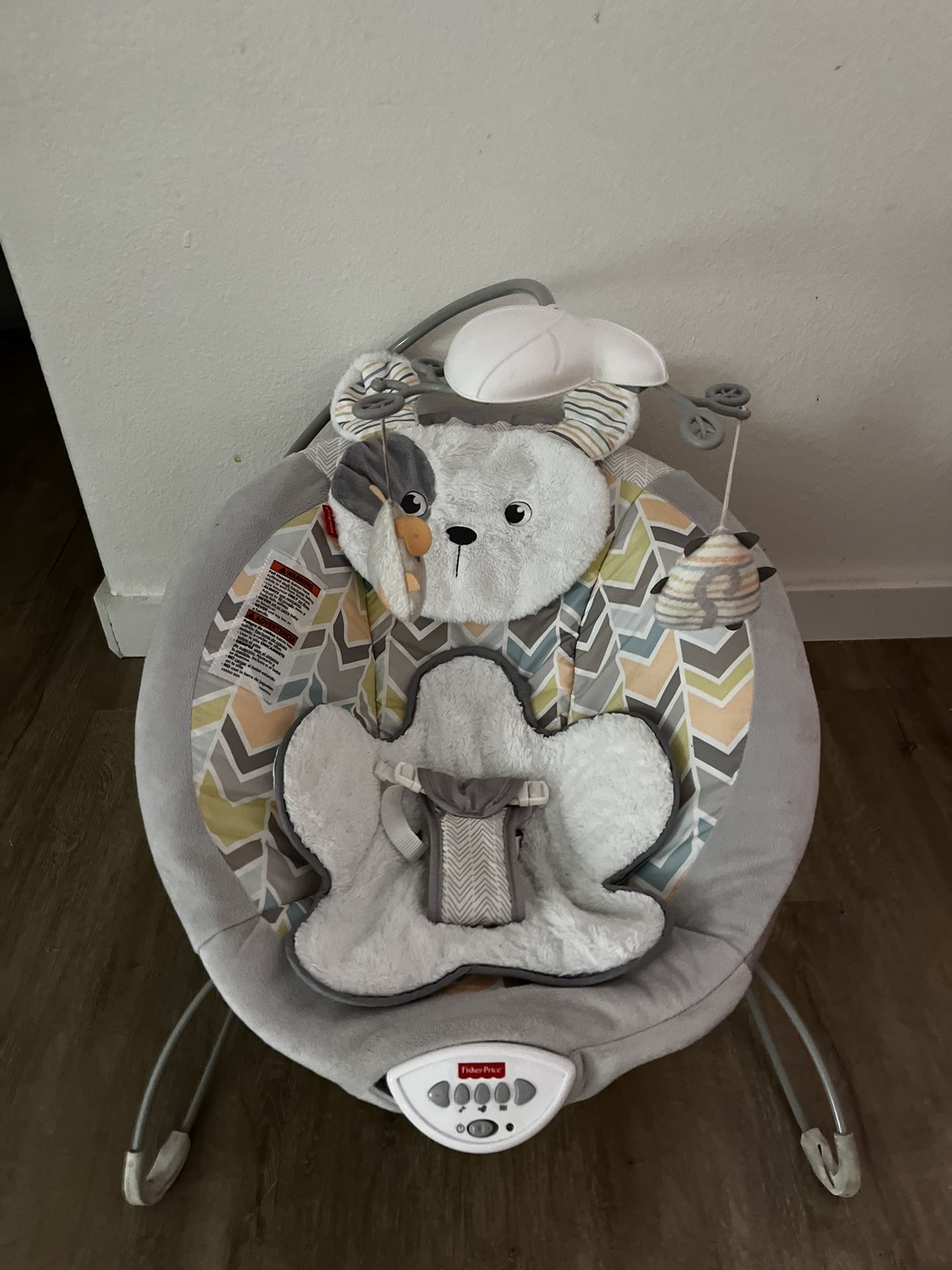 Fisher-Price Sweet Snugapuppy Deluxe Bouncer, portable bouncing baby seat with overhead mobile, music, and calming vibrations