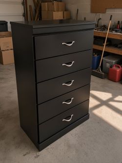 Dresser by Ashley Zanbury 5-drawer chest featuring a dark replicated mahogany finish and distinctive swoop-shaped nickel handles bedroom