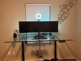 Custom electric adjustableh standing desk with 2x 24” inch wide screen Dell monitors.