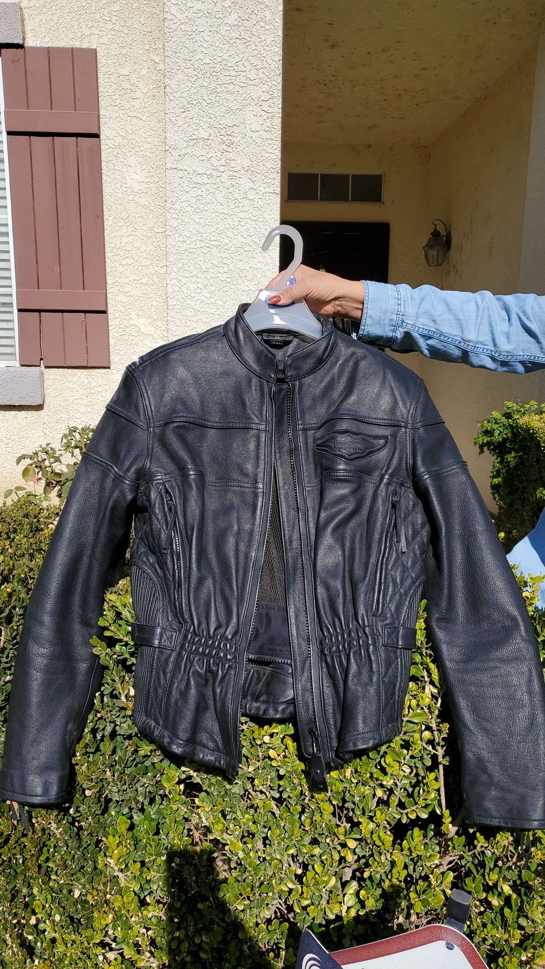 Womens leather Harley Davidson riding jacket... size small...has padding throughout arms and has inside liner.