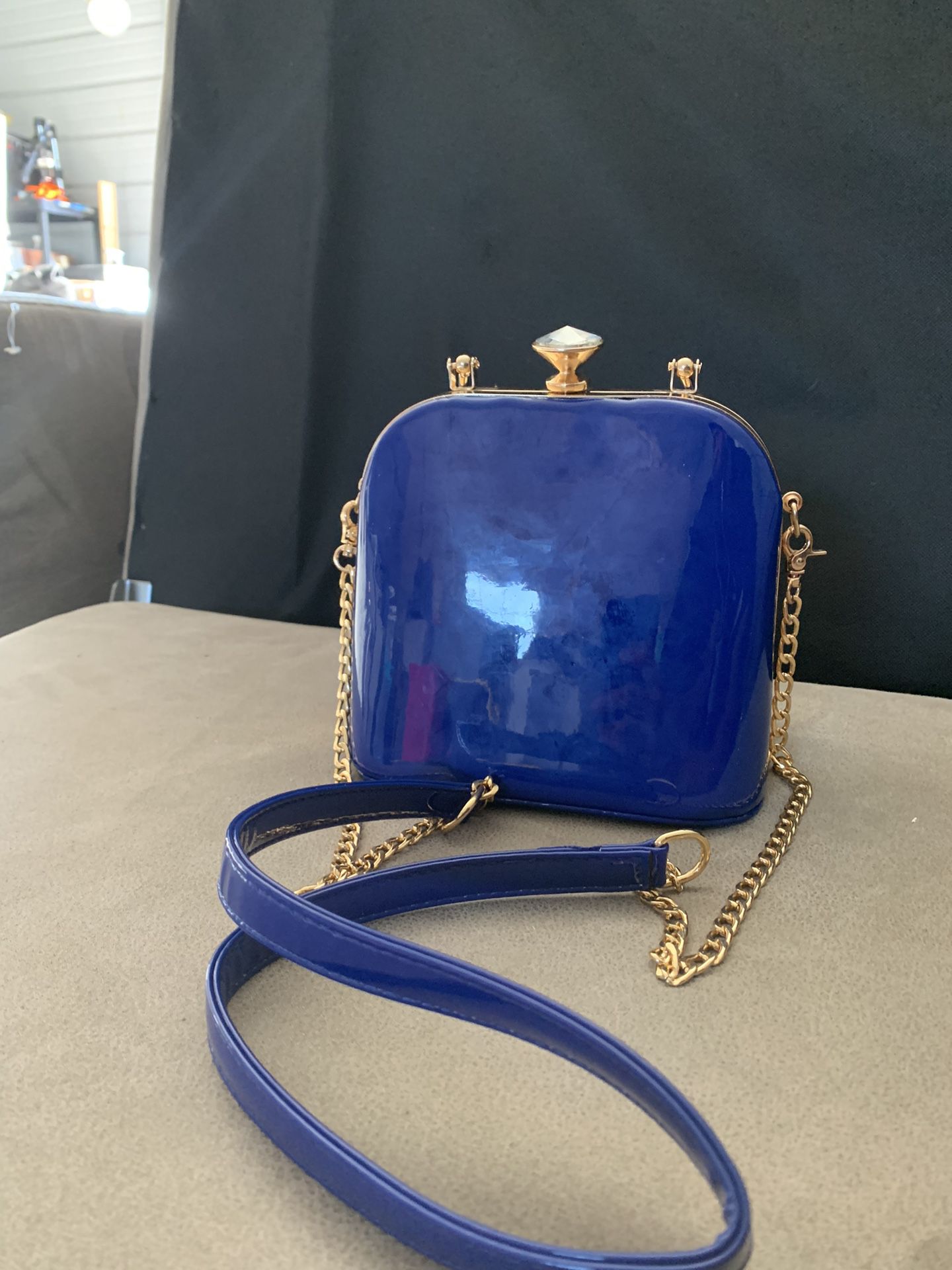 La Terre blue patent blue & gold tone evening bag/clutch