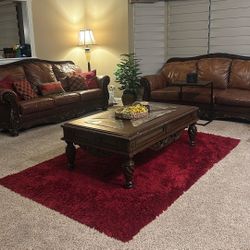 Ashley Furniture; 3 Brown Leather Couches, 2 Brown Accent Chairs, Marble And Wood Table And One Side Brown Coffee Table.
