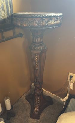 Ornate tall table with storage on top