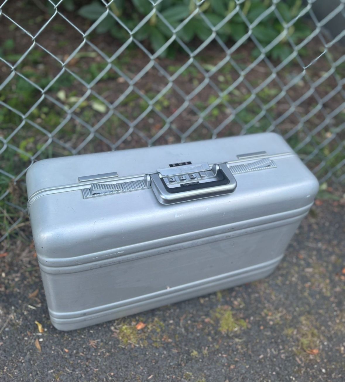 LOW PRICE MOVING- $900 RETAIL METAL SUITCASE 
