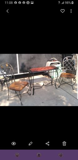 2 chairs and table/wood metal