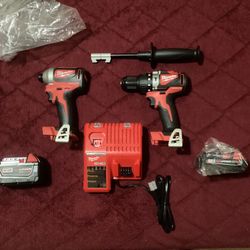 MILWAUKEE M18 Brushless Hammer Dril, Impact Driver, Charger And Two Batteries 