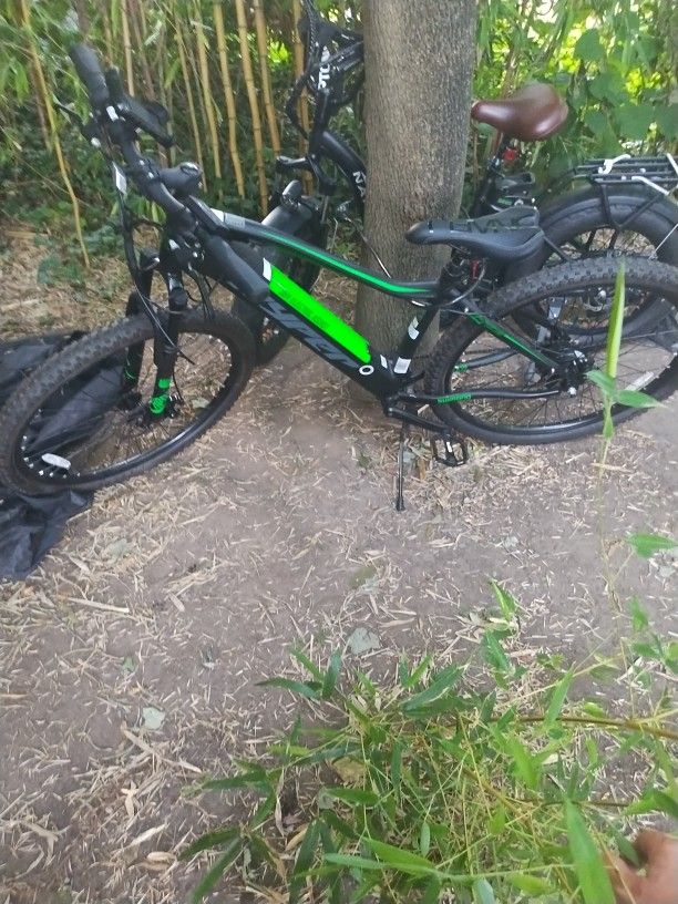 2 Bikes one is A 36 V Electric Assistshimano