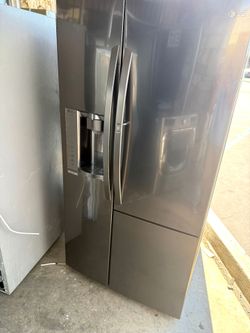 LG black stainless steel French door refrigerator and freezer