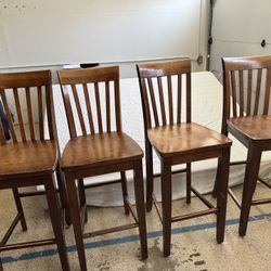 Four Brown Wooden Tall Chairs