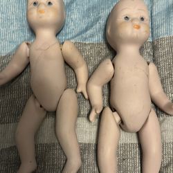 These are vintage porcelain dollhouse baby dolls, likely from the 1950s–1980s. Common brands: Shackman or Heidi Ott style.
