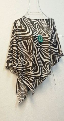 Brown zebra print poncho and turquoise necklace