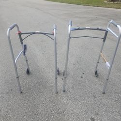 2 FOLDING LIKE NEW WALKERS $20 EACH