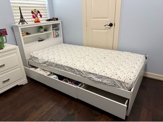 Twin bed with book case and mattress