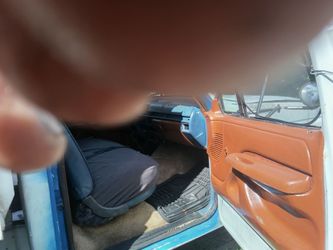 1996 Ford f450 super duty with a 5.8 l gasoline engine, dump bed