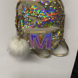 Justice girls gold unicorn backpack M logo