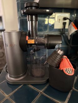 Ninja NeverClog Cold Press Juicer equipped with a slow-masticating auger and total pulp control.