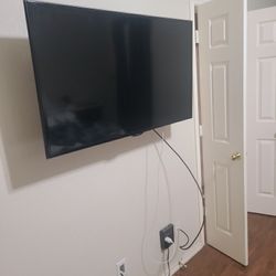 65” Wall Mounted TCL Flat Panel TV w/Roku