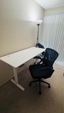 Electric standing desk and chair