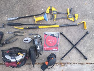Miscellaneous tools a brand new saw blade space heater pry bar couple clamps and other things