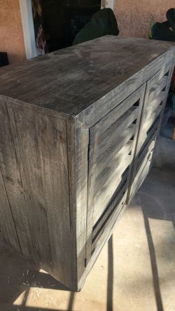 Grey Cabinet with shelves and doors.