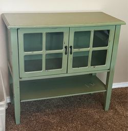 Distressed Sage Green Farmhouse Accent Cabinet with Glass Doors – 30”H