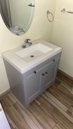 Gray Bathroom Vanity with Sink and Faucet
