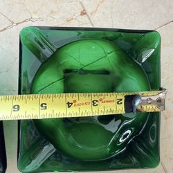 $10 Each  This vintage ashtray is made of 6” square emerald green glass, perfect for tabletop it still holds a unique charm
