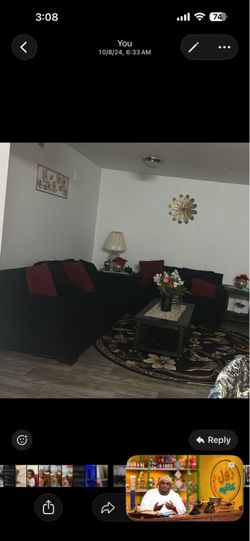 Black Sofa Set with Red Accent Pillows (Ashley furniture) couch and loveseat