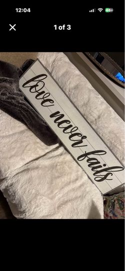Love Never Fails Wooden Wall Sign