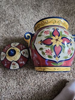 This appears to be a hand-painted Pier 1 Vallarta earthenware cookie jar featuring vibrant floral motifs and distinctive side handles