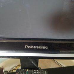 Panasonic TV With Glass Stand 