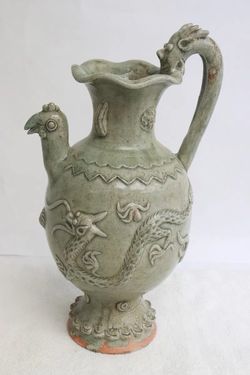 Fine Chinese celadon ewer with handle in dragon motif, 10.8"x6.3"x5.35"