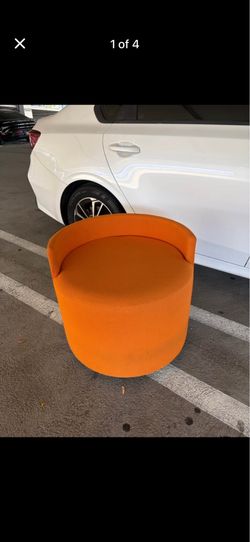 Mid-century, modern orange upholstery swivel chair