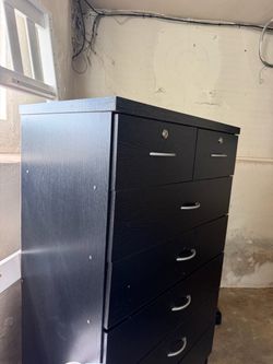 Chest with top drawer locks