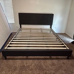 Charcoal colored Upholstered California King bed frame. 