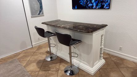 Bar with pair of bar stools.