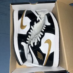 Jordan “Patent black and gold”