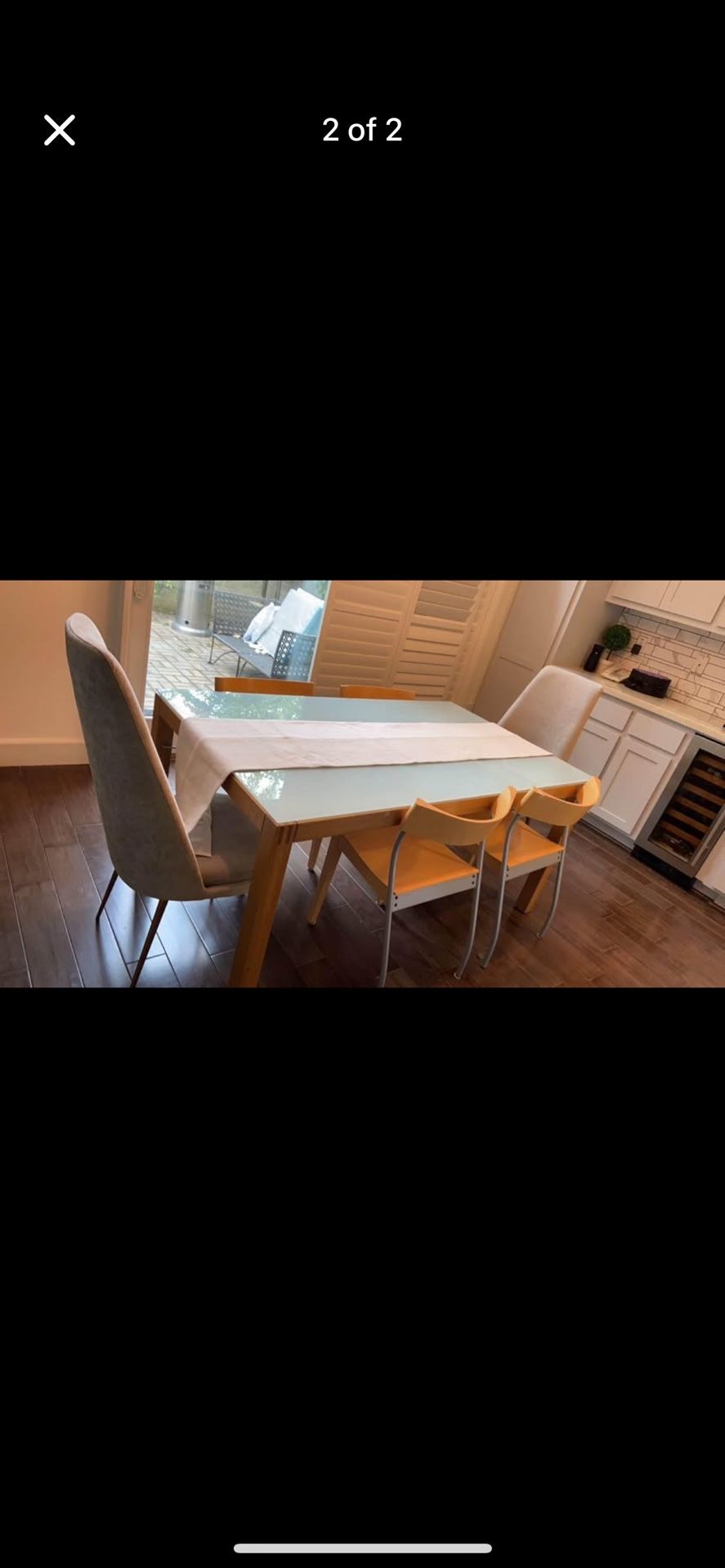 Glass Top Dining Table with 4 black leather chairs