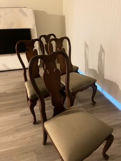 4 brown chairs