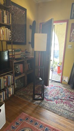 Standing lamp with shelves