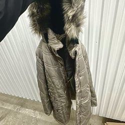 Women’s beige quilted winter jacket in size L 