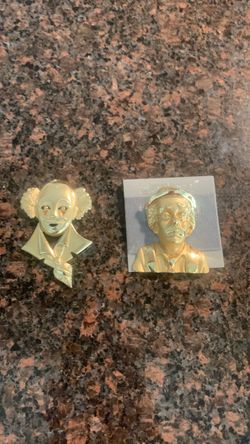 Like new 2 clown gold tone brouch pins selling as a pair