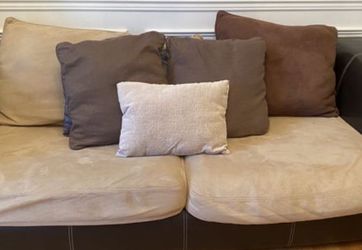 Nice couch leather and microfiber. Good condition. Some pillows included if interested.