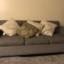 Comfortable 8x3 grey couch with free pillows included