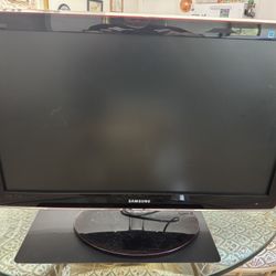 Samsung 27” flat screen with remote & stand.