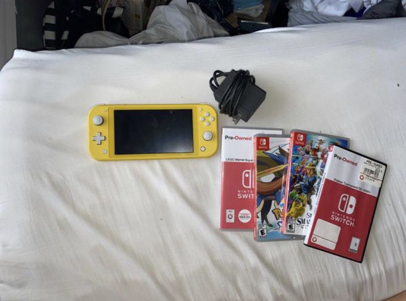 Nintendo Switch Lite (Yellow) with 4 games, Lego Marvel SH 2, Pokemon Sword, Super Smash Bro’s Ultimate, Pokken Tournament Dx