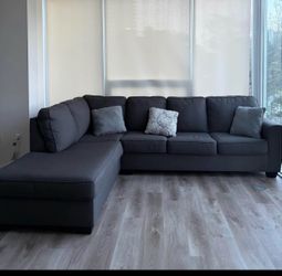 Beautiful charcoal grey sectional couch from Living Spaces LIKE NEW