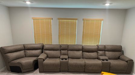 Ashley’s Furniture Sectional Reclining Sofa with Cup Holders