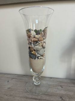 Decorative Glass Vase Filled with Layered Beach-themed Materials