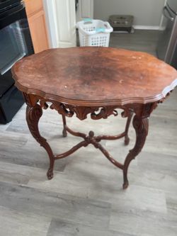 Ornate table, 3 ft high, brown